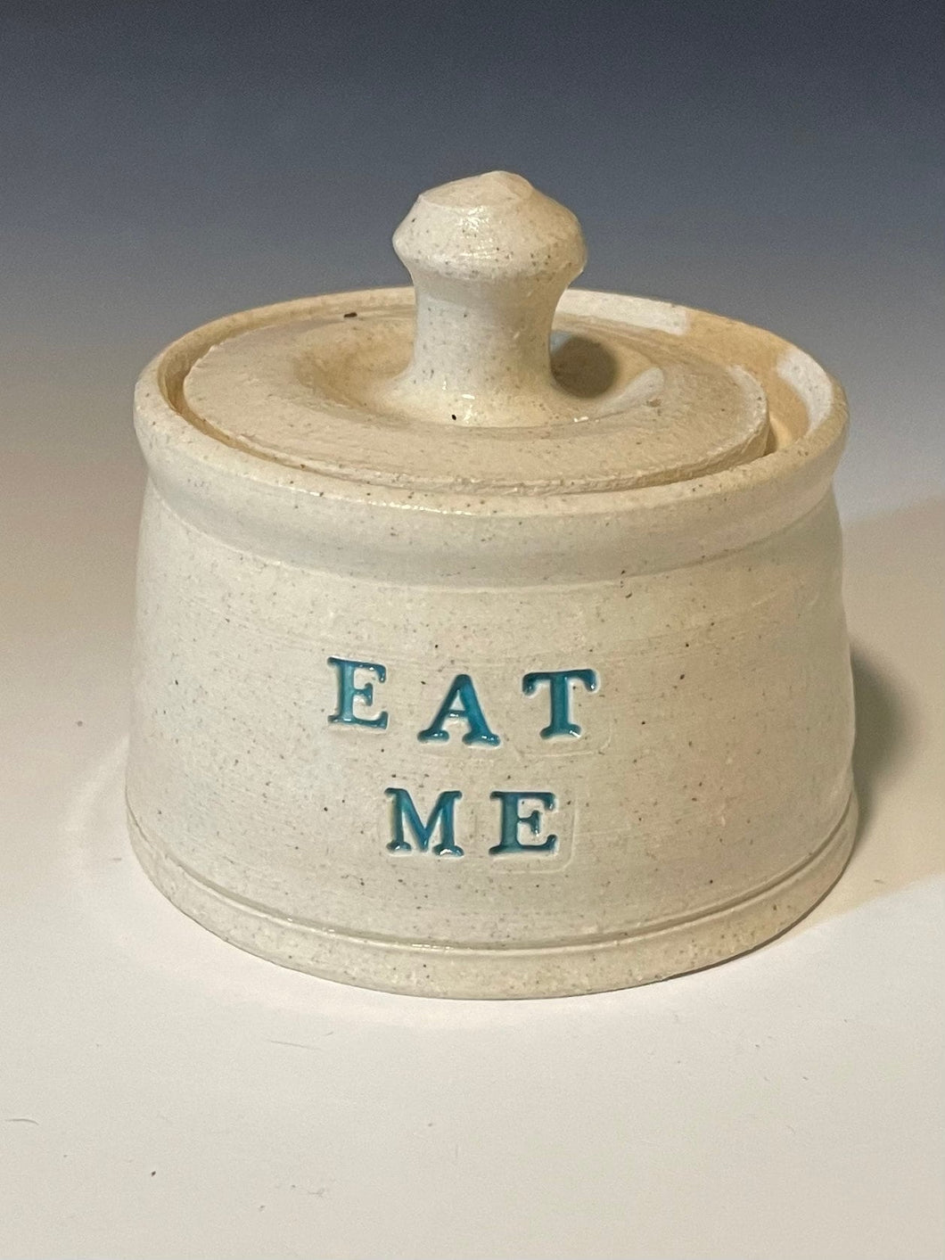 Tiny Eat Me Jar. need to shrink your ass down for entry into some fucked up land with queens and rabbits 'n' shit? look no further.